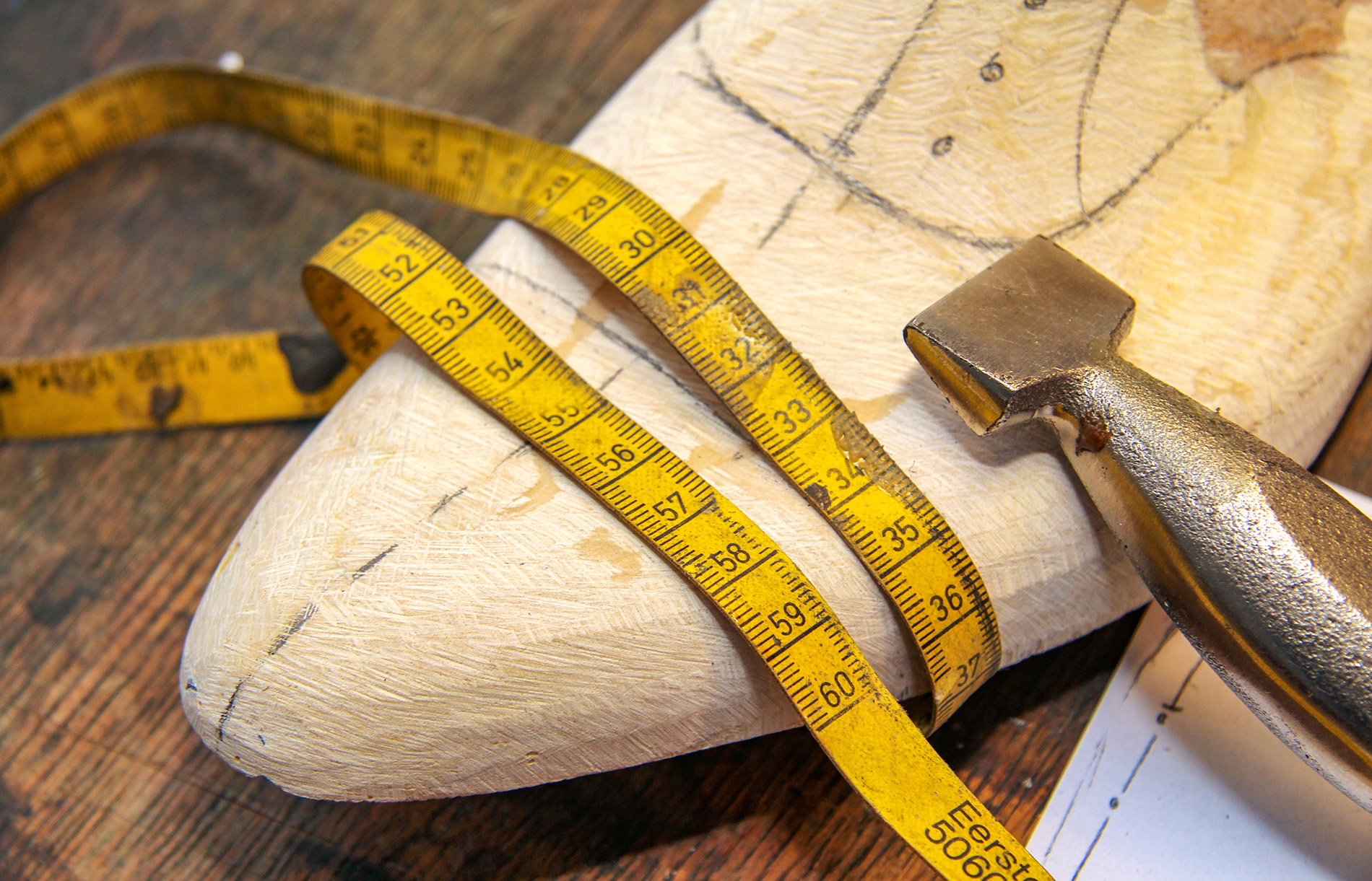 A shoemaker's last, symbolizing a bespoke journey.