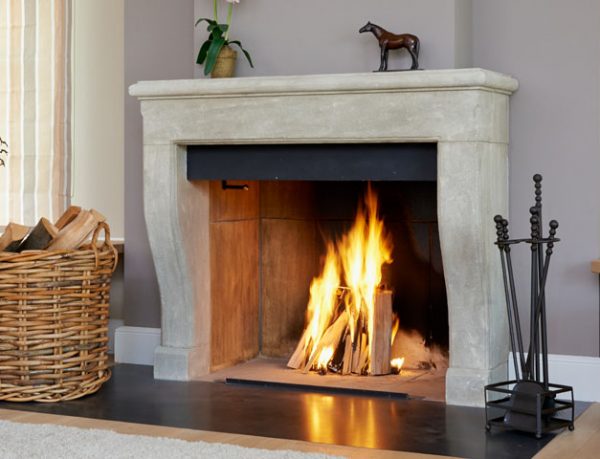 View of an Open Fireplace With Logfire